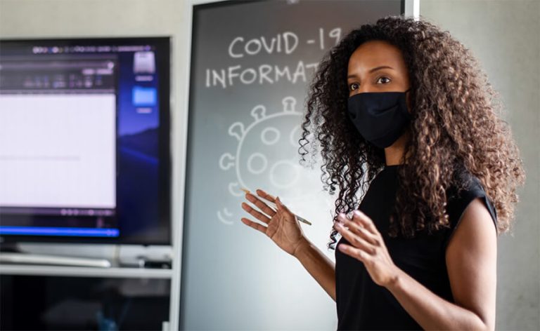 Instructor wearing covid mask while teaching